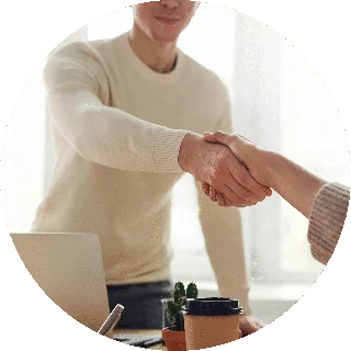 Business handshake during a sourcing meeting